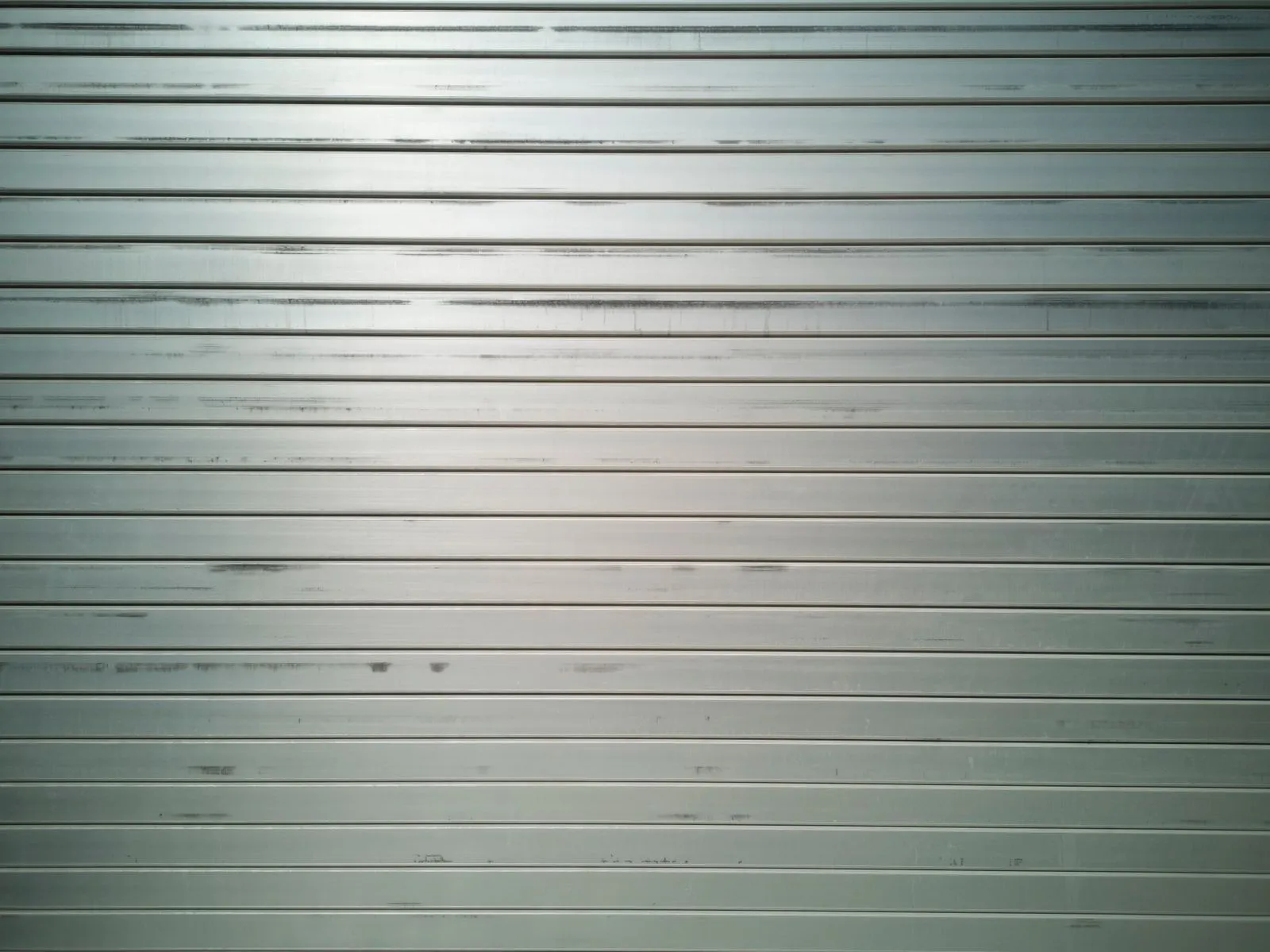 Modern horizontal slat sliding driveway gate