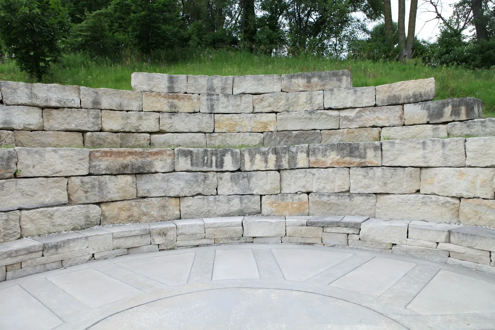 Limestone retaining wall in a landscaped garden