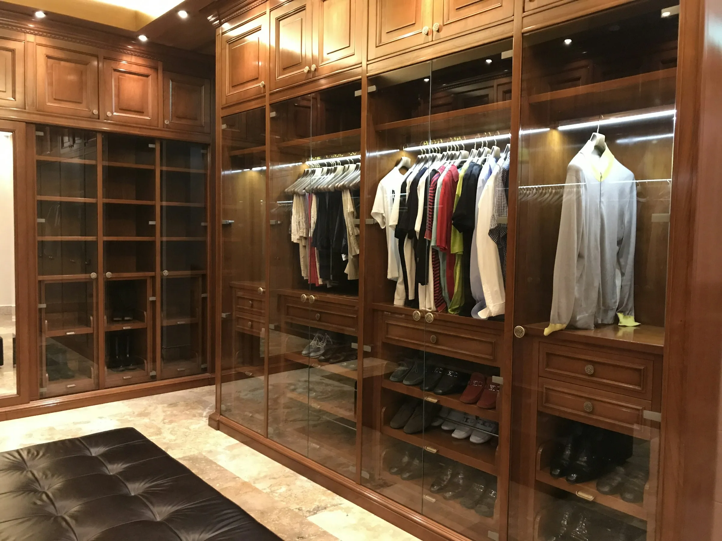 Custom-built timber walk-in robe with solid oak shelving and joinery