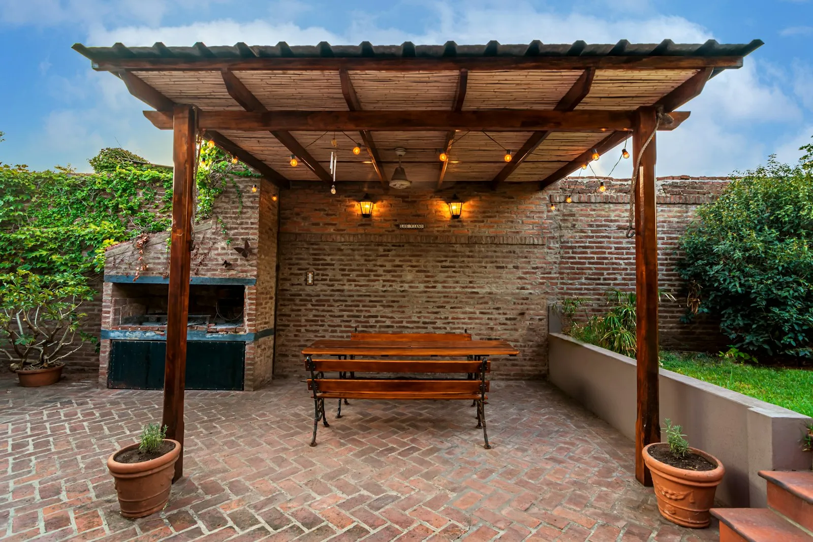 Timber pergola over a paved patio in spotted gum