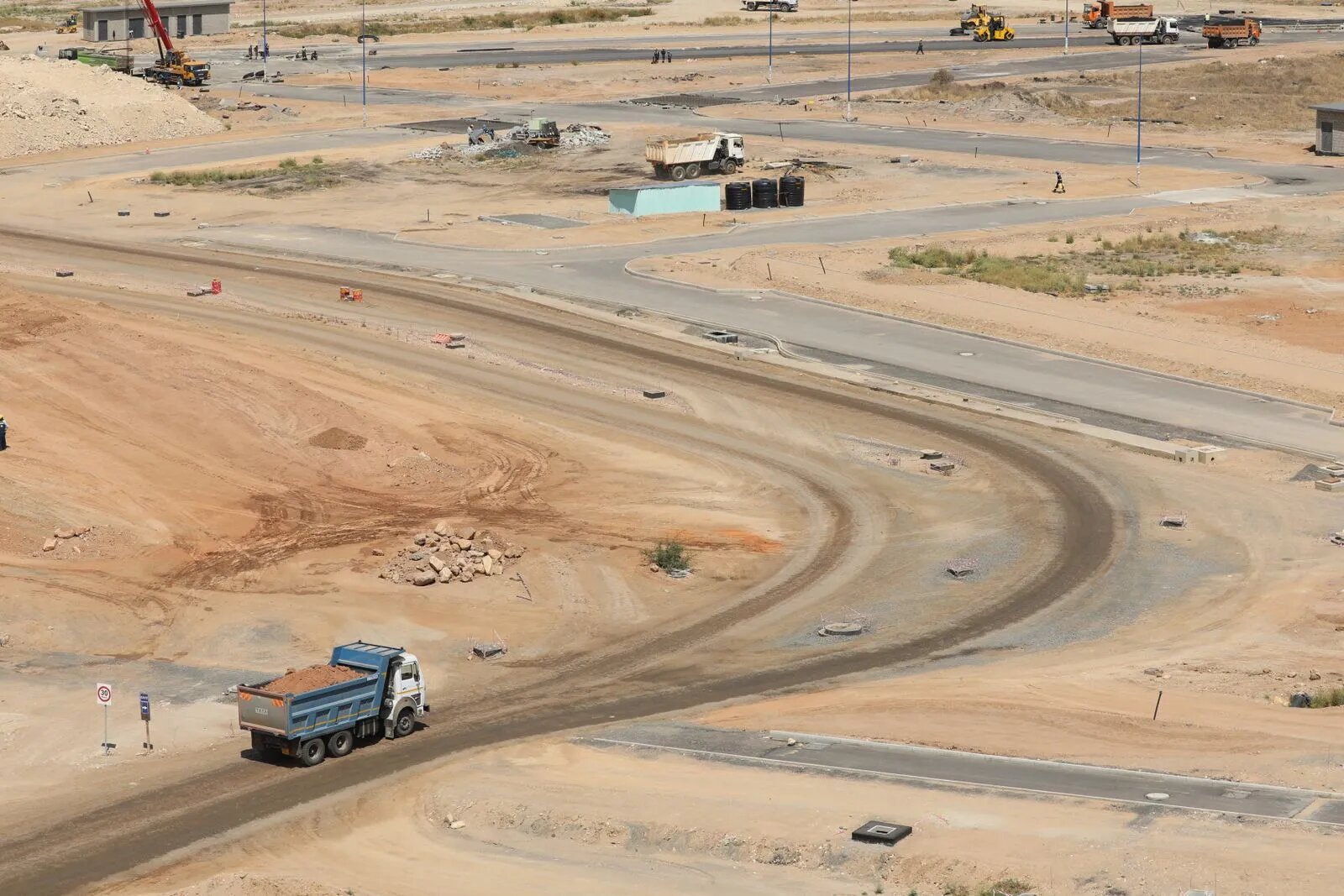 A cleared and graded block of ground after demolition
